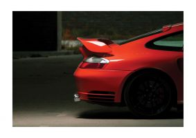 An unframed print of porsche rear sports photograph in grey and red accent colour