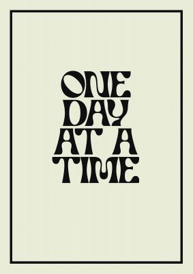 An unframed print of one day at a time quote in typography in beige and black accent colour