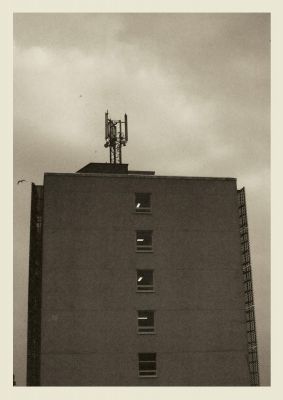 An unframed print of brutalist 35mm building graphical photograph in brown and grey accent colour