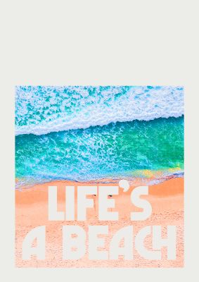 An unframed print of lifes a beach travel in typography in aquamarine and beige accent colour