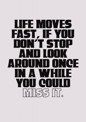 An unframed print of life moves fast inspirational quote in typography in beige and black accent colour