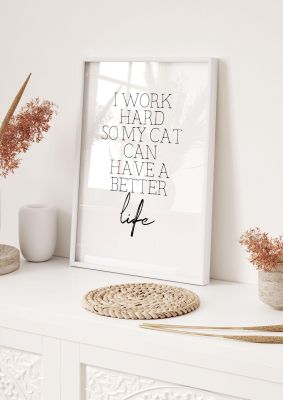 An unframed print of i work hard cat funny slogans in typography in white and black accent colour