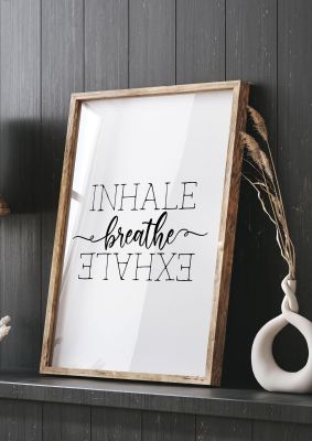 An unframed print of inhale exhale breathe quote in typography in white and black accent colour