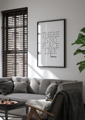 An unframed print of there is no place like home quote in typography in white and black accent colour