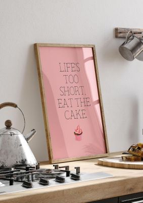 An unframed print of life is too short eat the cake funny slogans in typography in pink and black accent colour