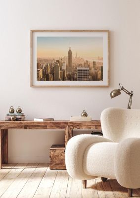 An unframed print of empire state building new york manhattan travel photograph in beige and blue accent colour