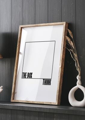 An unframed print of think outside the box quote in typography in white and black accent colour
