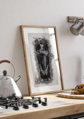 An unframed print of guinness pint splatter graphical illustration in black and gold accent colour