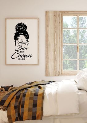 An unframed print of a messy bun is the crown of a mum funny slogans in typography in white and black accent colour