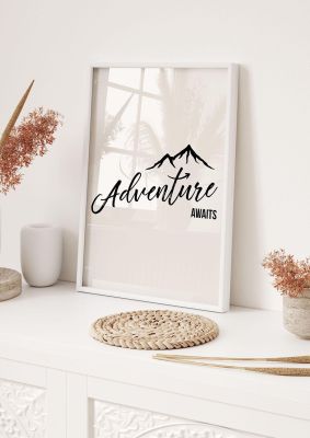 An unframed print of adventure awaits quote in typography in grey and black accent colour