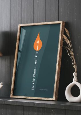 An unframed print of be the flame not the moth quote in typography in grey and orange accent colour