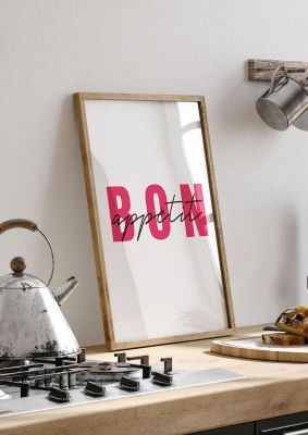 An unframed print of bon appetit quote in typography in white and red accent colour