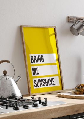 An unframed print of bring me sunshine quote in typography in yellow and black and white accent colour