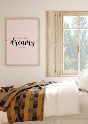 An unframed print of bring your dreams quote in typography in pink and black accent colour