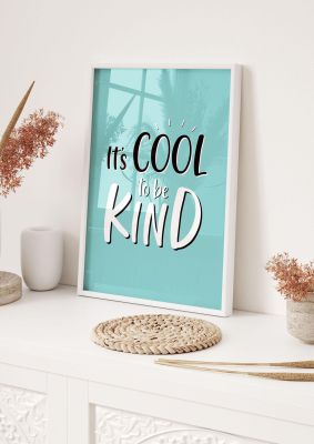 An unframed print of cool to be kind quote in typography in green and black and white accent colour
