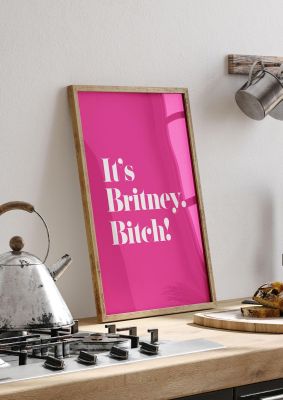 An unframed print of its britney bitch quote in typography in pink and white accent colour