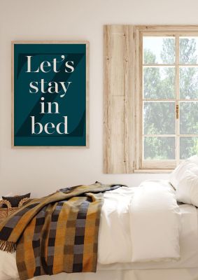 An unframed print of lets stay in bed funny slogans in typography in green and white accent colour