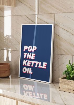 An unframed print of pop the kettle on quote in typography in blue and white accent colour