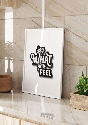 An unframed print of say what you feel quote in typography in white and black and white accent colour