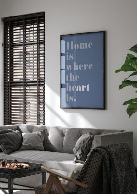 An unframed print of home is where the art is quote in typography in blue and grey accent colour