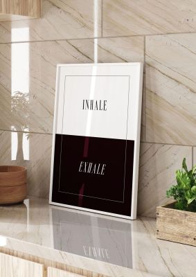 An unframed print of inhale exhale graphical in typography in black and white accent colour