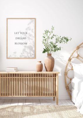 An unframed print of let you dreams blossom quote in typography in white and grey accent colour