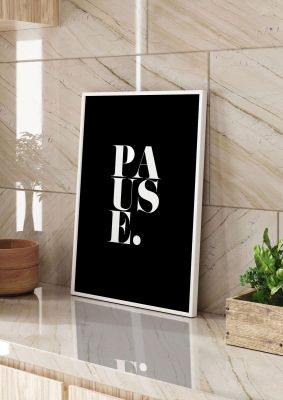 An unframed print of pause quote in typography in black and white accent colour