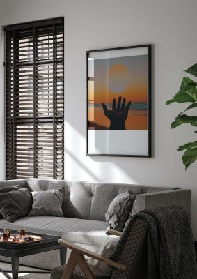 An unframed print of chasing the sun golden hour hand beach graphical photograph in orange and black accent colour