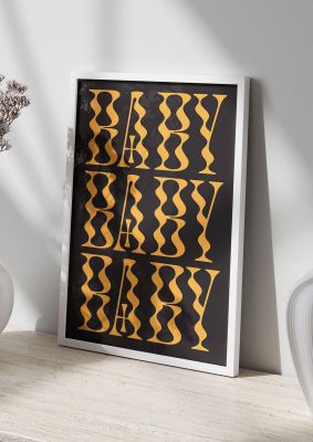 An unframed print of baby x3 quote in typography in black and gold accent colour