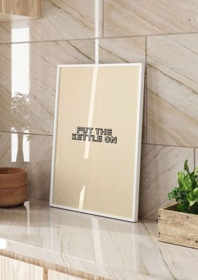 An unframed print of put the kettle on quote in typography in beige and black accent colour