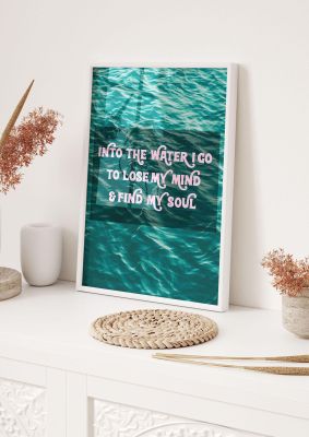 An unframed print of into the water rhyme swimming quote in typography in green and pink accent colour