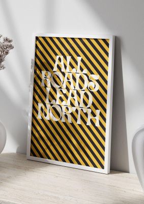 An unframed print of all roads lead north typographic funny slogans in typography in yellow and black accent colour