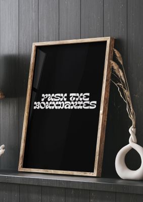 An unframed print of push the boundaries quote in typography in black and white accent colour