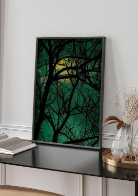 An unframed print of sunset through trees green botanical photograph in green and black accent colour