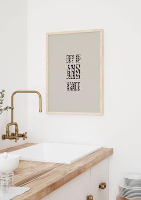 An unframed print of get up and dance quote in typography in beige and black accent colour