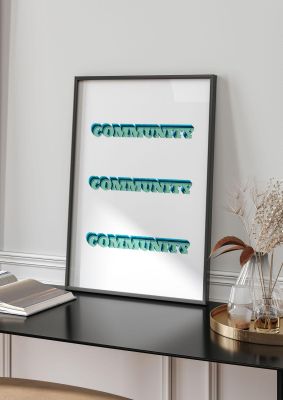 An unframed print of community quote in typography in white and green accent colour