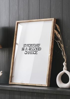 An unframed print of everyday is a second chance inspirational quote in typography in grey and white accent colour
