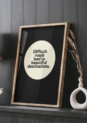 An unframed print of difficult roads inspirational quote in typography in black and beige accent colour