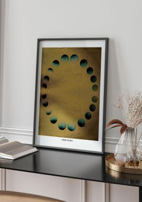 An unframed print of gold blue moon phases graphical illustration in brown and gold accent colour