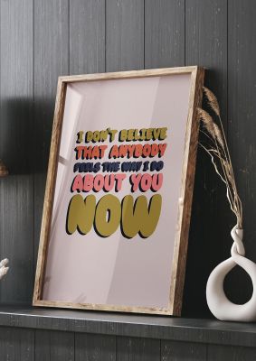 An unframed print of wanderwall lyric quote in typography in pink and multicolour accent colour