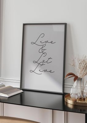 An unframed print of script live let live quote in typography in grey and black accent colour