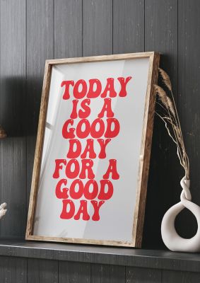 An unframed print of good day inspirational quote in typography in grey and red accent colour