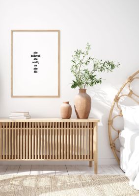 An unframed print of she believed she could so she did inspirational quote in typography in white and black accent colour