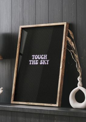 An unframed print of touch the sky lyric kanye west music in typography in black and lilac accent colour