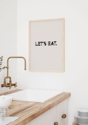 An unframed print of lets eat kitchen graphical in typography in beige and black accent colour