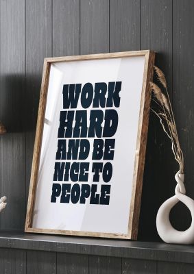 An unframed print of work hard and be nice to people quote in typography in white and black accent colour