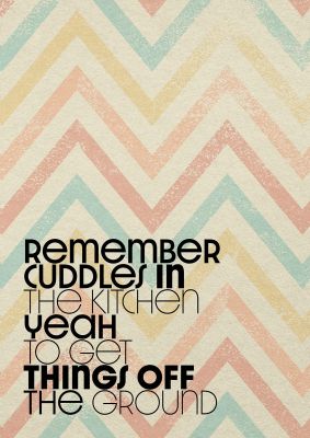 An unframed print of remember cuddles in the kitchen lyrics maps in typography in beige and multicolour accent colour