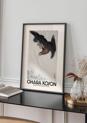 An unframed print of ohara koson eagle flying in snow 1933 a famous paintings illustration in white and black accent colour