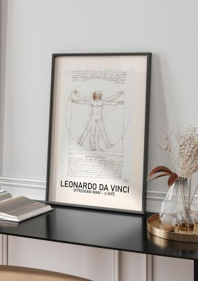 An unframed print of leonardo da vinci vitruvian man 1492 famous paintings graphic in beige and white accent colour