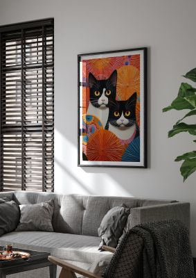Two black and white cats with colourful circular patterns